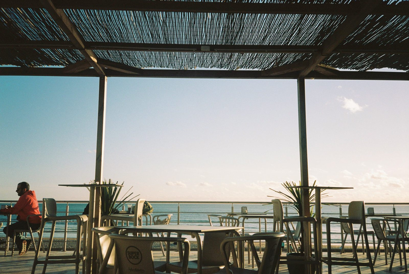 A beachside café terrace in Carcavelos, Portugal, where Bonjournal founder Tom started his language journaling habit